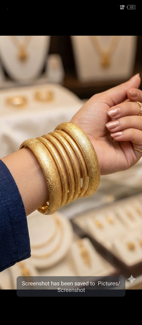 Chandi Chudiyan" (Silver Bangles) or more descriptively