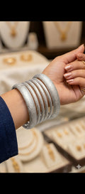 Chandi Chudiyan" (Silver Bangles) or more descriptively